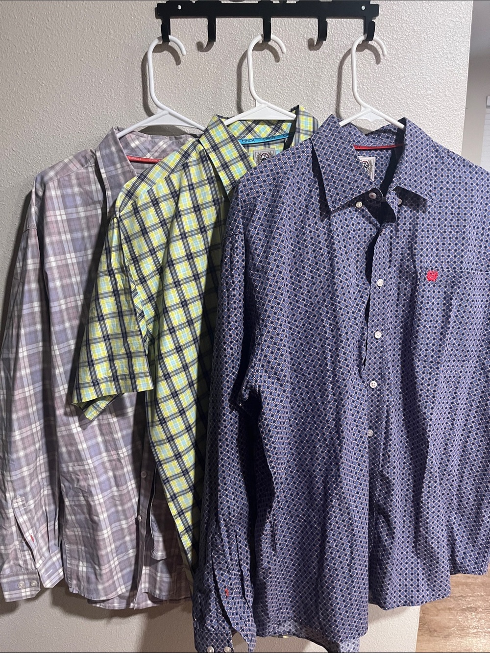 A three pack of cinch two long sleeves and one short sleeve with a little hole